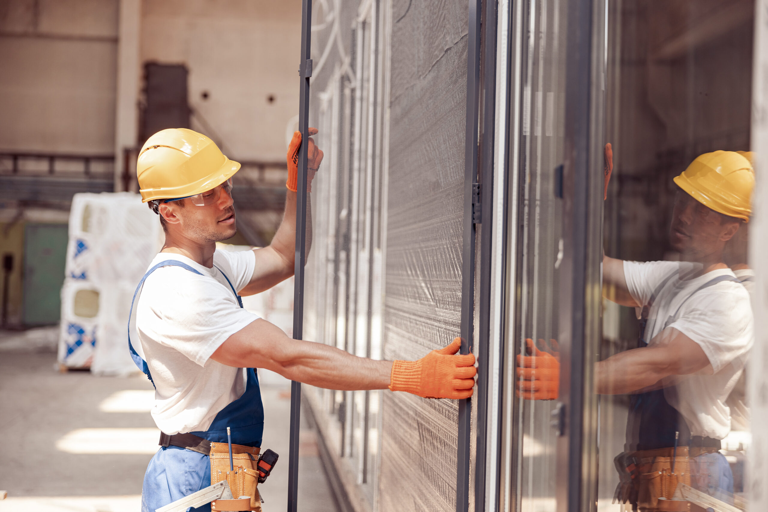 https://www.vidrosteel.com/wp-content/uploads/2024/04/male-worker-installing-sliding-glass-door-at-const-2023-11-27-05-36-33-utc-scaled.jpg